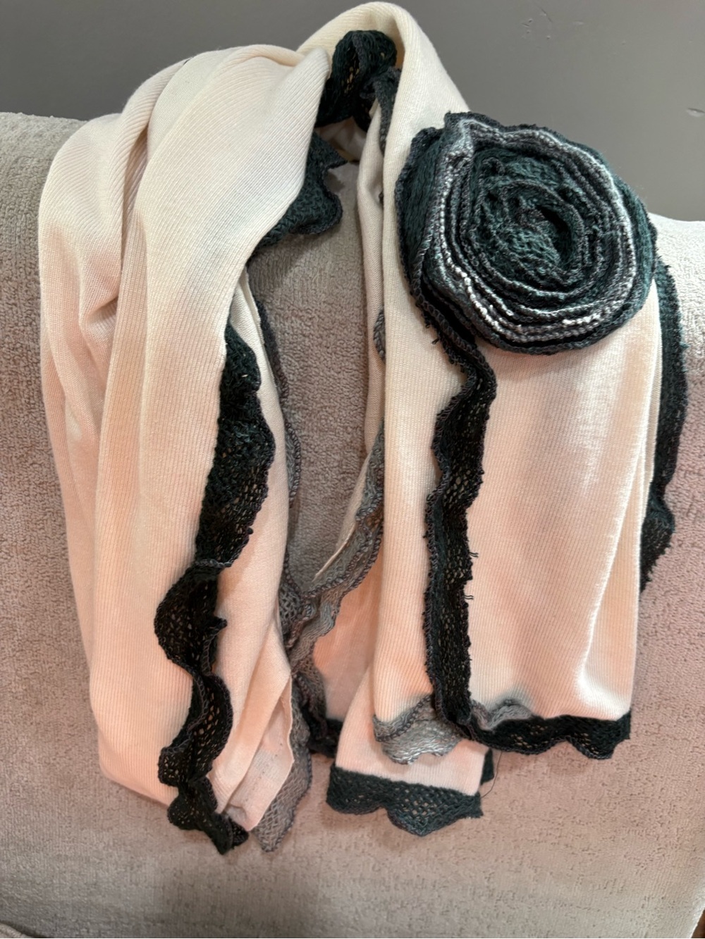 Soft Cream Scarf with Black Trim and Rosette Accent